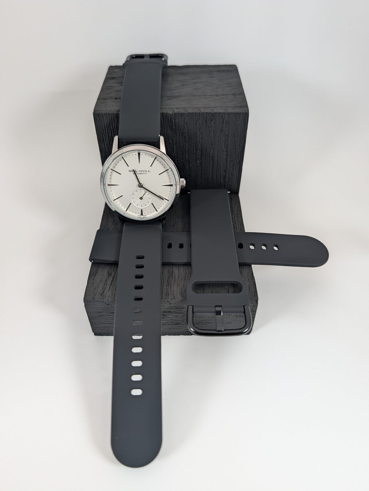 Black silicone strap fitted on a watch (watch not included)